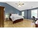 Spacious main bedroom with sloped ceiling, fan, hardwood floors, and natural light at 18711 Crestline Ct, Noblesville, IN 46060