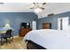 Bright main bedroom with sloped ceiling, desk, tv, and hardwood floors at 18711 Crestline Ct, Noblesville, IN 46060