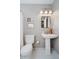 Charming bathroom showcasing a pedestal sink, a toilet, and a stylish mirror, creating a serene space at 18760 Pilot Mills Dr, Noblesville, IN 46062