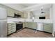 Contemporary kitchen with stainless steel appliances and views into the living room at 18760 Pilot Mills Dr, Noblesville, IN 46062