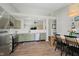 Well-lit kitchen featuring modern appliances, tile backsplash, and open layout at 18760 Pilot Mills Dr, Noblesville, IN 46062
