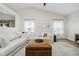 Spacious living room with vaulted ceilings, neutral tones, and open floor plan to kitchen at 18760 Pilot Mills Dr, Noblesville, IN 46062