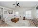 Bright living room featuring vaulted ceilings, large windows, and contemporary furnishings at 18760 Pilot Mills Dr, Noblesville, IN 46062