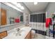 Clean bathroom with vanity, framed mirror, and shower with decorative curtain at 188 Bay Ridge Dr, Pendleton, IN 46064