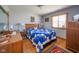 Comfortable bedroom features a blue quilt, hardwood floors, and wood accents at 188 Bay Ridge Dr, Pendleton, IN 46064