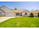 Charming single-story brick home with a well-kept lawn and attached two-car garage at 188 Bay Ridge Dr, Pendleton, IN 46064
