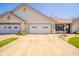 Charming brick home with a two-car garage, neat landscaping, and inviting front entrance at 188 Bay Ridge Dr, Pendleton, IN 46064