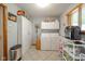 Practical laundry room with modern washer and dryer, storage cabinets, and tile flooring at 188 Bay Ridge Dr, Pendleton, IN 46064