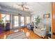 Cozy living room with hardwood floors, ceiling fan, and lots of natural light at 188 Bay Ridge Dr, Pendleton, IN 46064