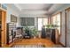 Well-lit living room with hardwood floors, large windows, and entertainment center at 188 Bay Ridge Dr, Pendleton, IN 46064
