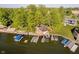 Aerial showcasing lakeside home with multilevel deck and private docks for watercrafts at 1940 Stringtown Pike, Cicero, IN 46034