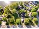 Overhead view of homes set among mature trees with driveways and landscaping at 1940 Stringtown Pike, Cicero, IN 46034
