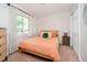 Comfortable bedroom with a neutral color scheme, carpeted floors, and a large window at 1940 Stringtown Pike, Cicero, IN 46034