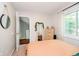 Comfortable bedroom with a neutral color scheme, carpeted floors, and a large window at 1940 Stringtown Pike, Cicero, IN 46034