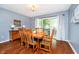 Light-filled dining room featuring hardwood floors and sliding door access to the outside at 1940 Stringtown Pike, Cicero, IN 46034