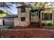Charming stone-clad home with wooden steps leading to the entrance and an attached two-car garage at 1940 Stringtown Pike, Cicero, IN 46034