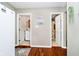 Hallway view with access to the laundry room and bathroom at 1940 Stringtown Pike, Cicero, IN 46034