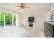 Bright and airy main bedroom with a ceiling fan, carpeted floors, and access to a balcony at 1940 Stringtown Pike, Cicero, IN 46034