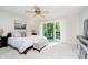 Bright and airy main bedroom with a ceiling fan, carpeted floors, and access to a balcony at 1940 Stringtown Pike, Cicero, IN 46034