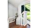 Bright staircase with natural light and modern design featuring a decorative table at 1940 Stringtown Pike, Cicero, IN 46034
