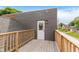Wooden balcony with wood railings overlooking a residential area at 2302 S Pennsylvania St, Indianapolis, IN 46225
