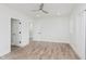 Bright bedroom features light walls, light-colored floors and a ceiling fan at 2302 S Pennsylvania St, Indianapolis, IN 46225