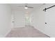 Bright bedroom features white walls, white trim and a door to the backyard at 2302 S Pennsylvania St, Indianapolis, IN 46225