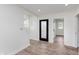 Bright hallway featuring luxury vinyl plank floors and lots of natural light at 2302 S Pennsylvania St, Indianapolis, IN 46225
