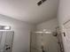 Bathroom features a tiled shower with glass doors, bright vanity lighting, and neutral tones at 240 Legends Creek Pl # Apt 310, Indianapolis, IN 46229