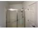 Bathroom features a tiled shower with glass doors and neutral tones at 240 Legends Creek Pl # Apt 310, Indianapolis, IN 46229