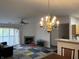 Bright living room featuring a fireplace, dining area, sliding glass doors and hardwood floors at 240 Legends Creek Pl # Apt 310, Indianapolis, IN 46229