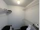 Spacious walk-in closet provides ample storage with shelving units at 240 Legends Creek Pl # Apt 310, Indianapolis, IN 46229
