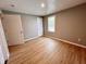 Inviting bedroom with wood-look floors, natural light, and a neutral color palette at 2417 Crystal St, Anderson, IN 46012