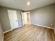 Bright bedroom featuring modern wood-look floors and plenty of natural light at 2417 Crystal St, Anderson, IN 46012
