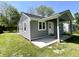 Charming gray home with a covered front porch at 2417 Crystal St, Anderson, IN 46012