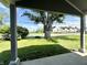 Charming front yard featuring a large tree and beautiful landscaping at 2417 Crystal St, Anderson, IN 46012