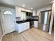 Bright kitchen featuring white cabinets and stainless steel appliances at 2417 Crystal St, Anderson, IN 46012
