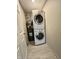 Practical laundry area features a stacked washer/dryer set and water heater at 2417 Crystal St, Anderson, IN 46012