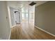 Open living space with wood-look flooring, neutral walls, and plentiful lighting at 2417 Crystal St, Anderson, IN 46012