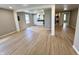 Open-concept living space with modern flooring, kitchen and laundry access at 2417 Crystal St, Anderson, IN 46012