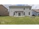 Spacious backyard with a pergola, fire pit, and sliding glass doors leading into the home's interior at 2780 Cormorant Dr, Greenwood, IN 46143