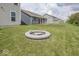Backyard view of a firepit and a large grassy space at 2780 Cormorant Dr, Greenwood, IN 46143