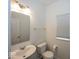 Half bathroom includes a sink, toilet, and window at 2780 Cormorant Dr, Greenwood, IN 46143