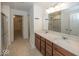 Bathroom with double vanity, granite countertops, and walk-in closet access at 2780 Cormorant Dr, Greenwood, IN 46143