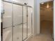 Bathroom shower with glass door and tile surround next to walk-in closet at 2780 Cormorant Dr, Greenwood, IN 46143
