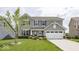 Charming two-story home with gray siding, attached two car garage, and a well manicured front yard at 2780 Cormorant Dr, Greenwood, IN 46143