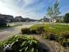 Beautifully landscaped front yard with lush greenery and a well-manicured lawn in a great community at 2780 Cormorant Dr, Greenwood, IN 46143