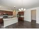 Spacious eat-in kitchen features a large island, modern lighting, and stainless steel appliances at 2780 Cormorant Dr, Greenwood, IN 46143