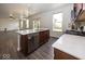Kitchen view showcases stainless steel dishwasher and sink, and view to living room at 2780 Cormorant Dr, Greenwood, IN 46143