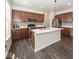 Bright kitchen features stainless steel appliances, a large island, and a decorative tile backsplash at 2780 Cormorant Dr, Greenwood, IN 46143